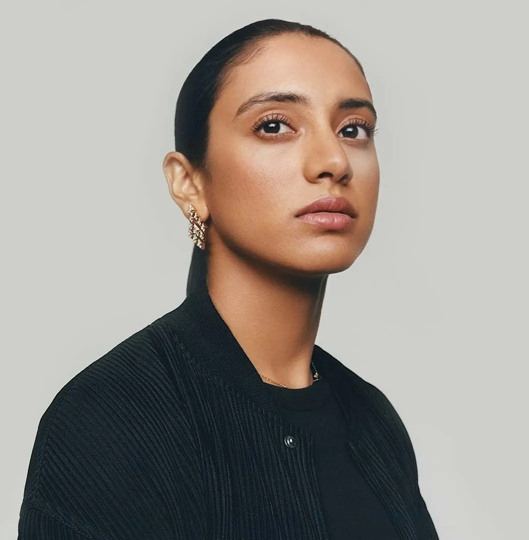 Smriti Mandhana striking a confident pose on field