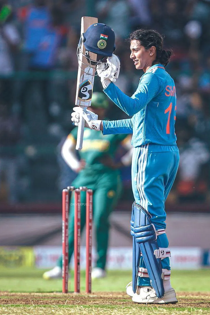 Smriti Mandhana striking a pose while practicing cricket