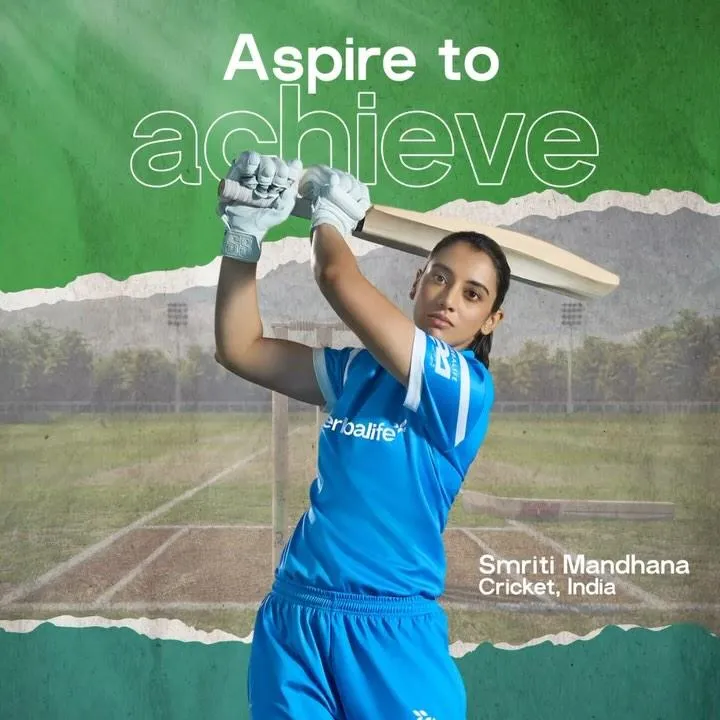 Smriti Mandhana swinging bat in full blue cricket kit
