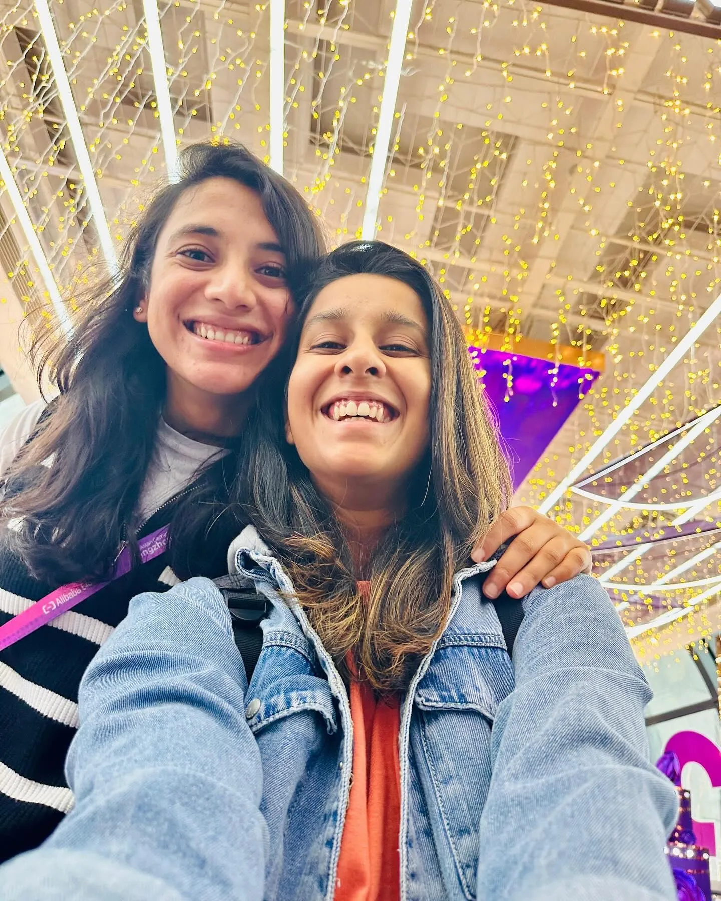 Smriti Mandhana taking a selfie with a close friend outdoors