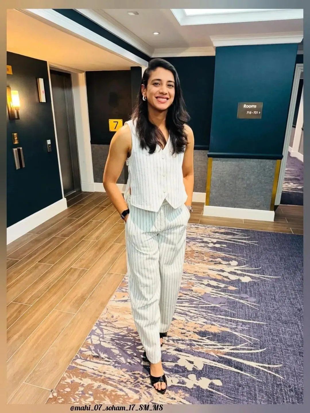 Smriti Mandhana walking indoors wearing a casual stylish outfit