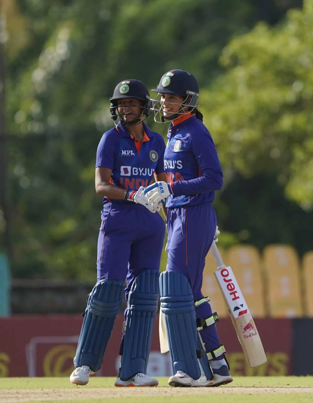 Smriti Mandhana walking with her teammates on the field