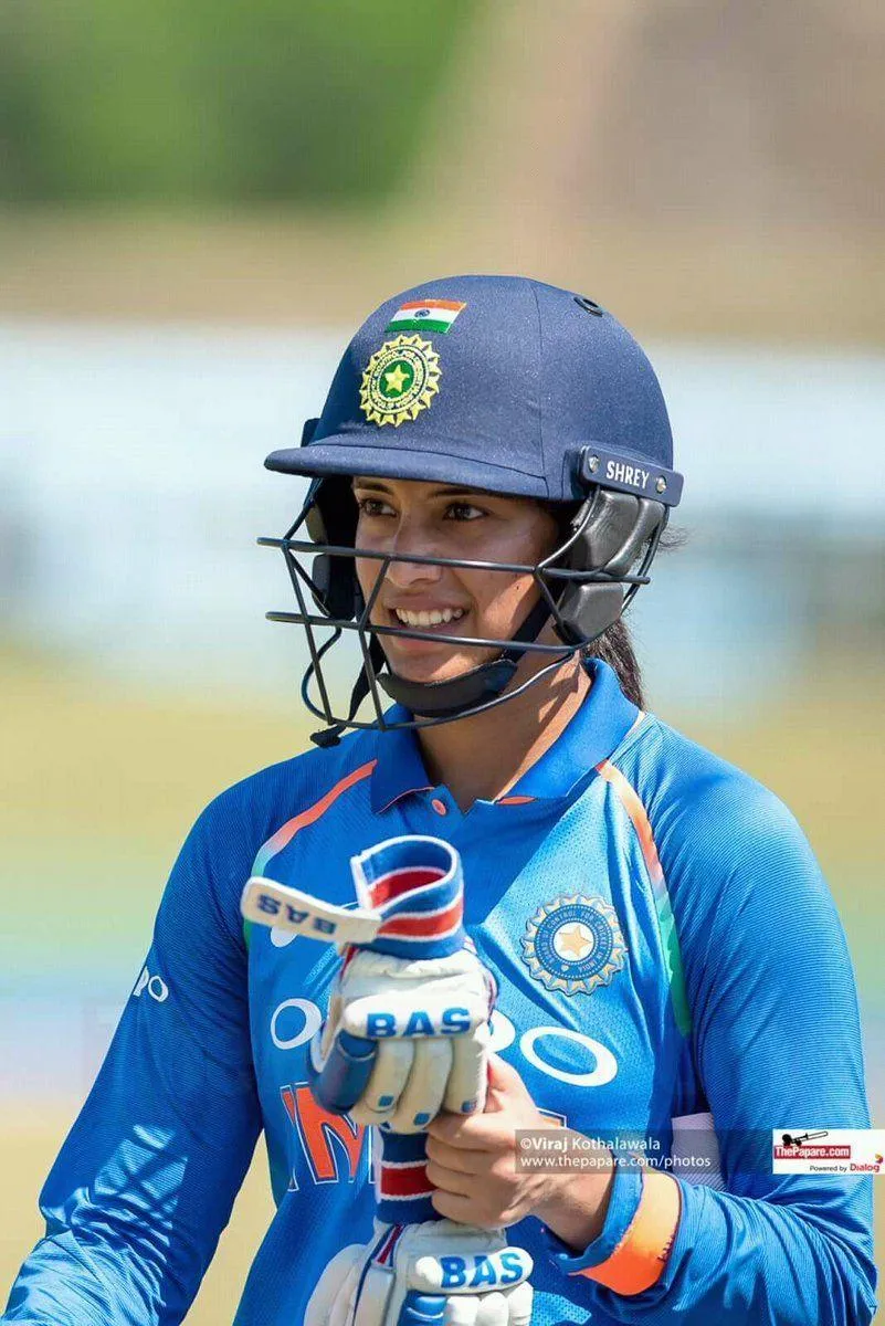 Smriti Mandhana wearing her cricket helmet on field