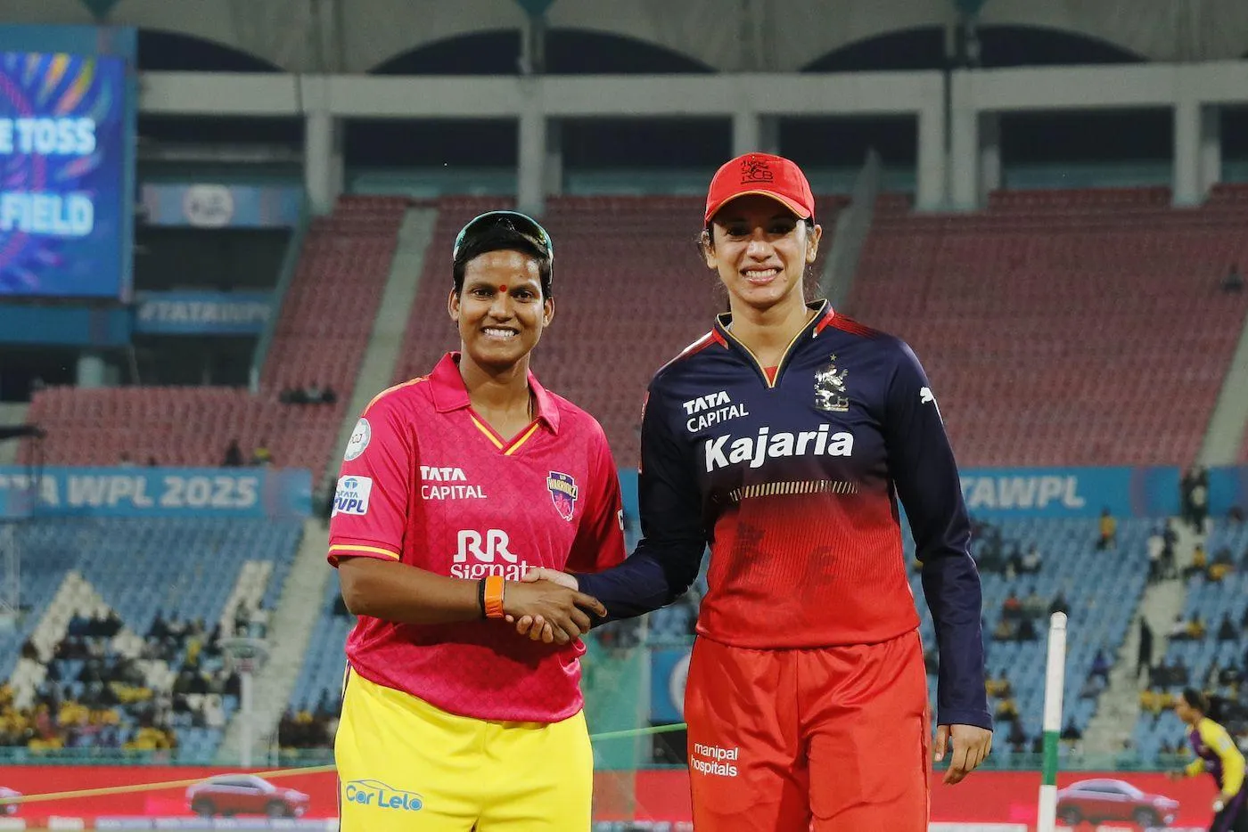 Smriti Mandhana with fellow cricketer before a match