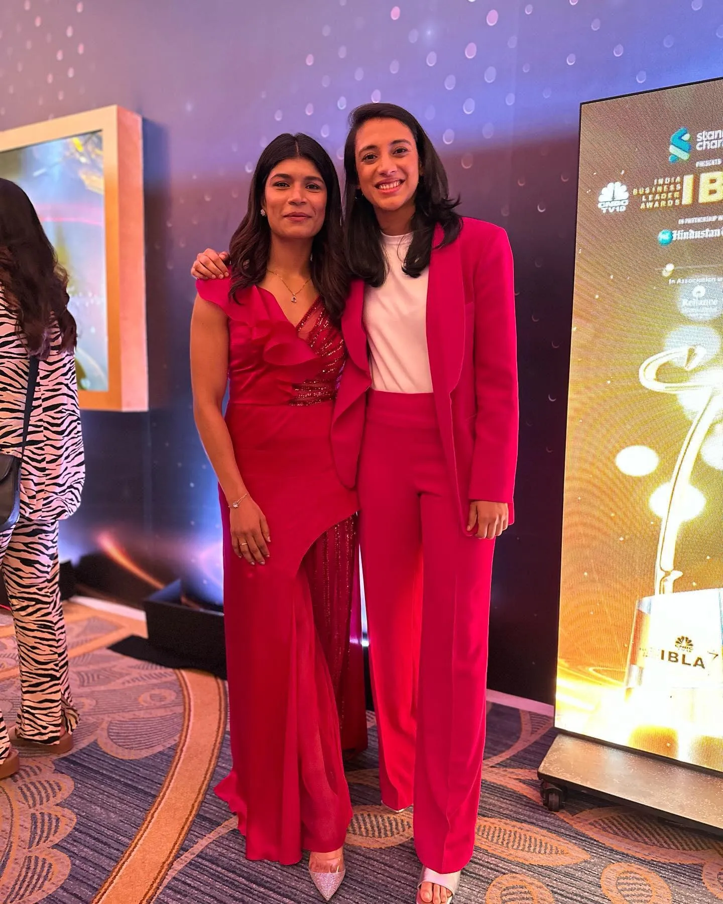Smriti Mandhana with friend in red and pink party outfits
