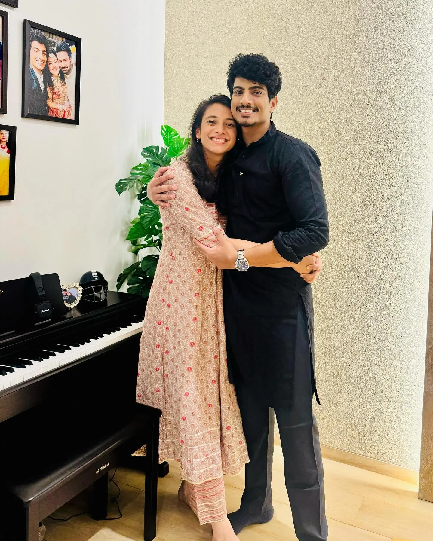 Smriti Mandhana with friend smiling in festive Indian outfits