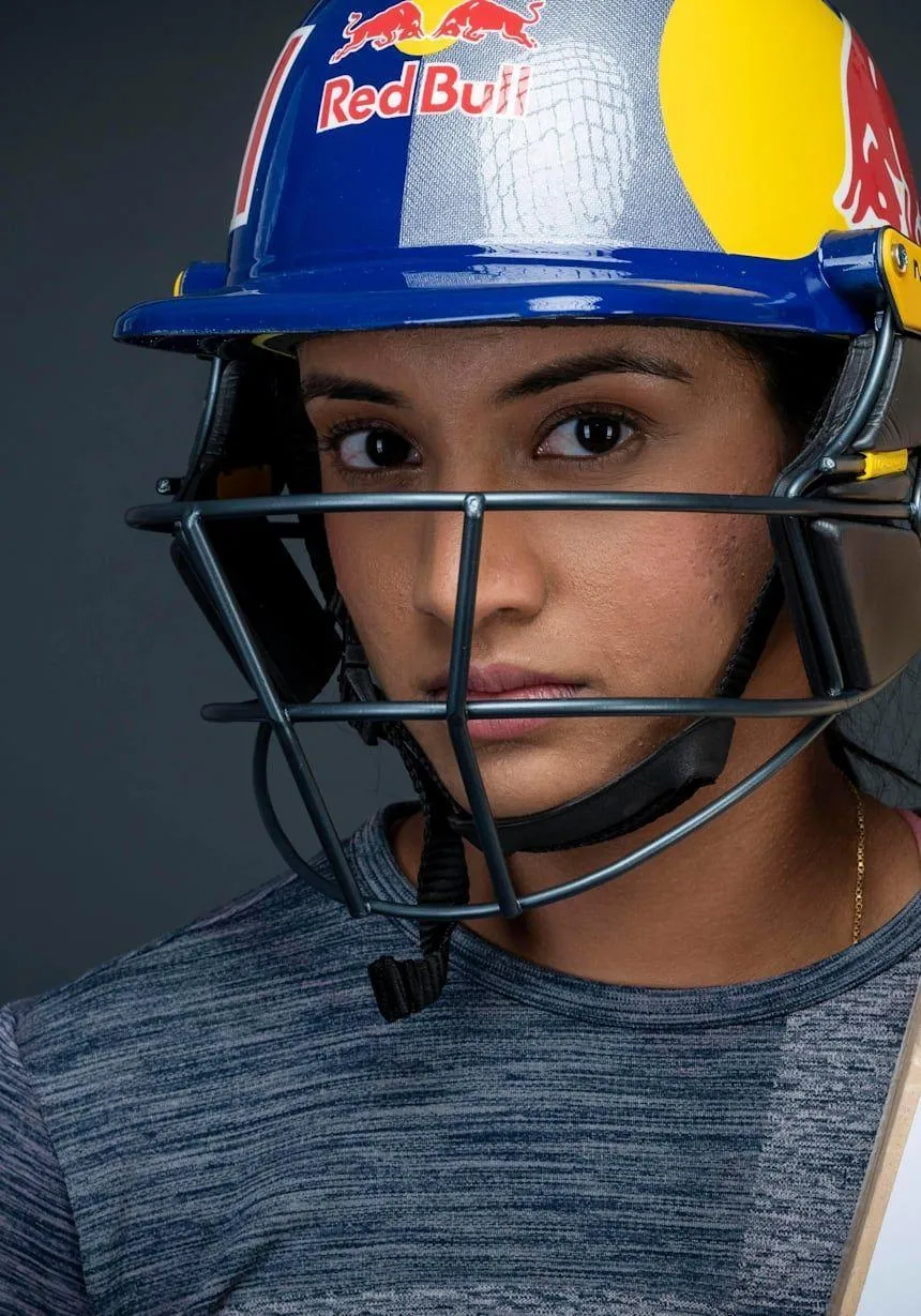 Smriti Mandhana with helmet preparing for a match wallpaper