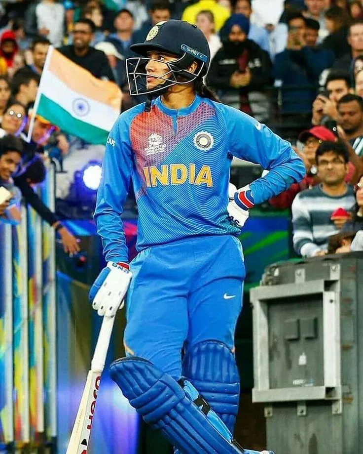 Smriti Mandhana with her coach sharing a joyful moment