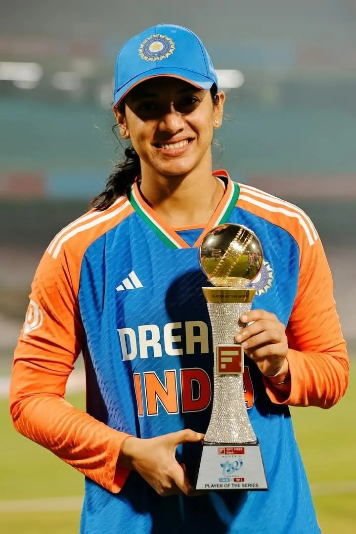 Smriti Smiling Proudly Holding the Team Jersey wallpaper