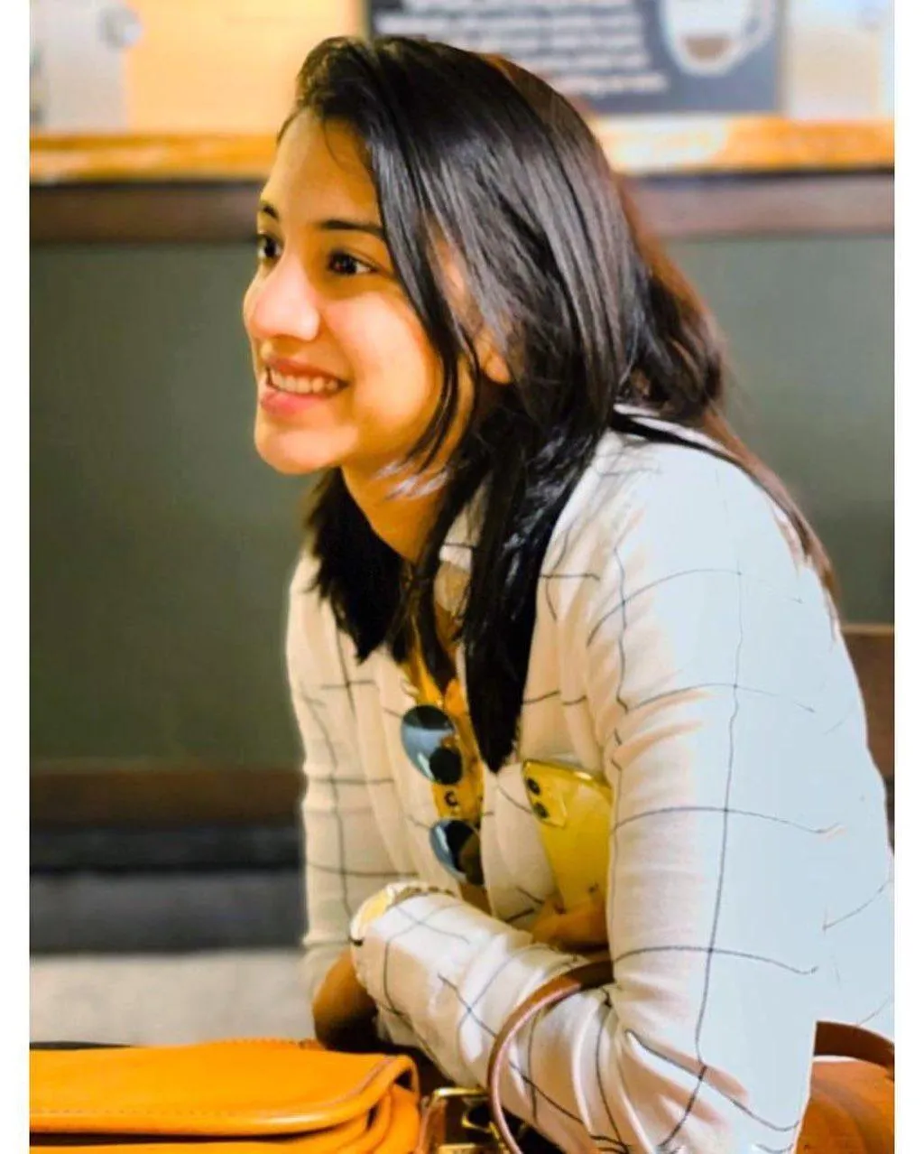 Smriti Smiling Warmly in Casual White Outfit wallpaper