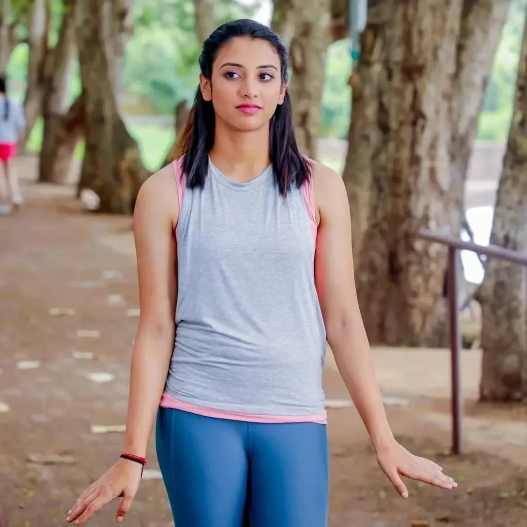 Smriti Standing Calmly Among Trees in Casual Outfit