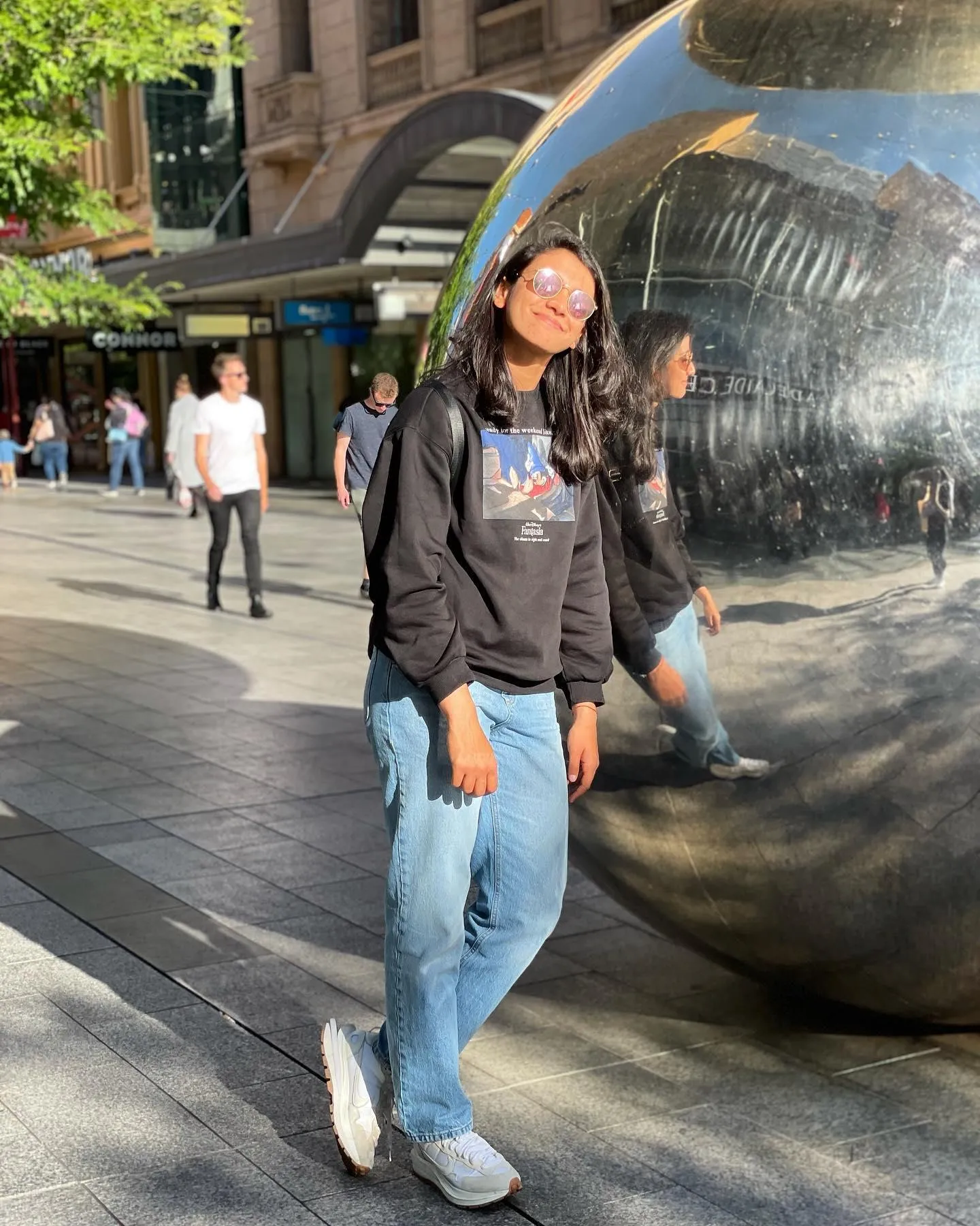 Smriti walking on the street in casual wear smiling