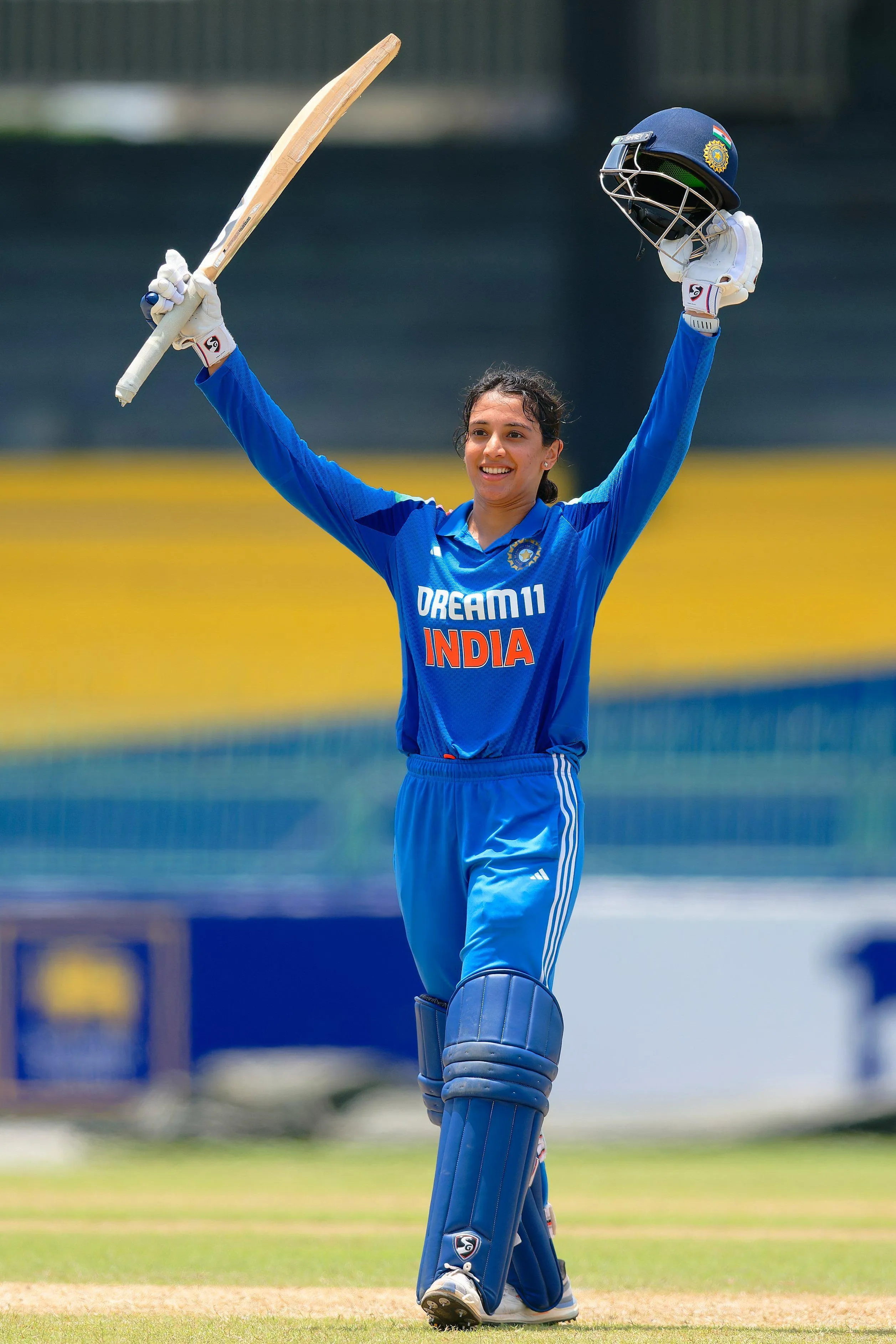 Victorious moment in cricket with helmet raised wallpaper