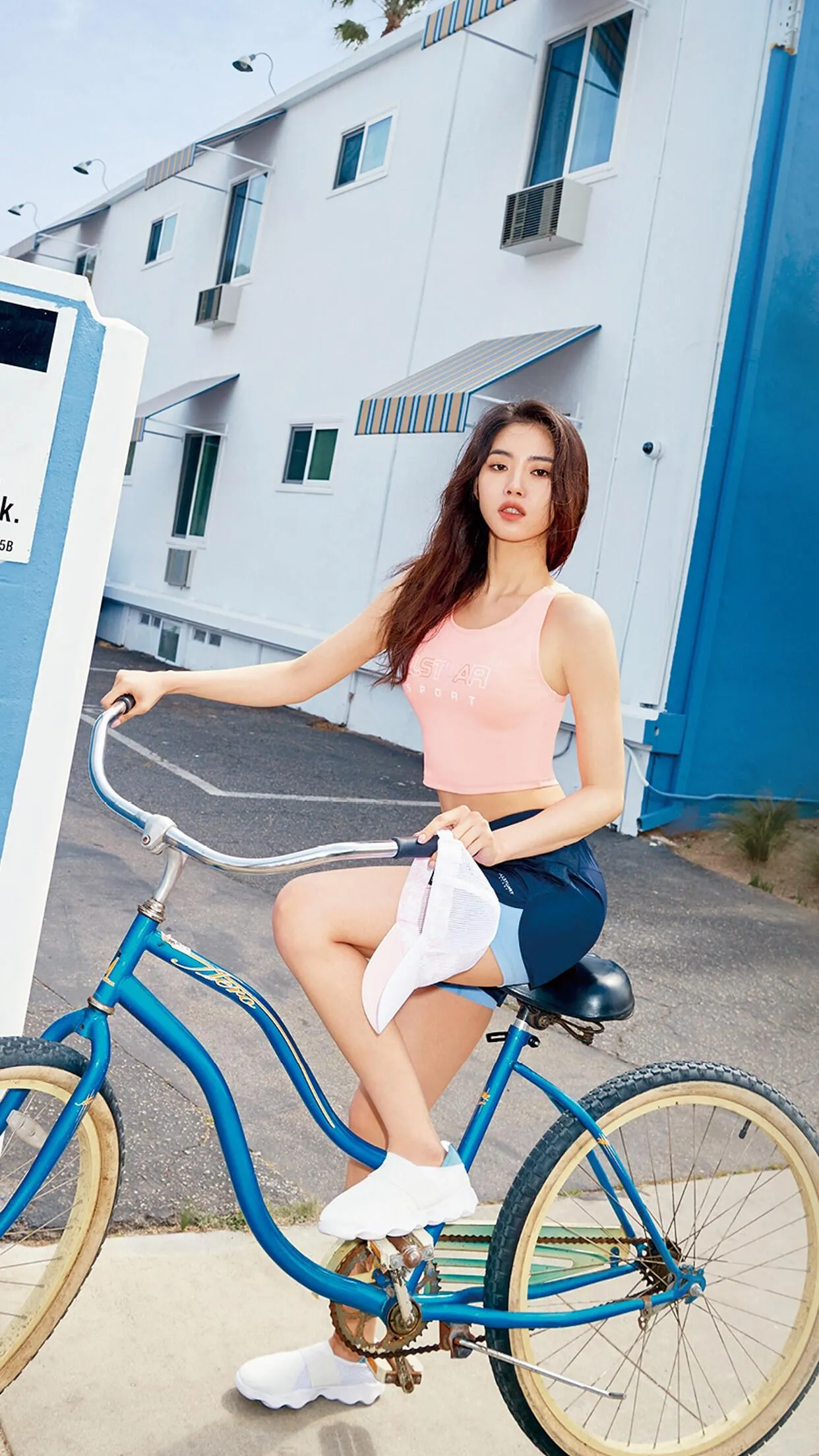 Adventurous Woman Riding a Motorcycle Through the Desert