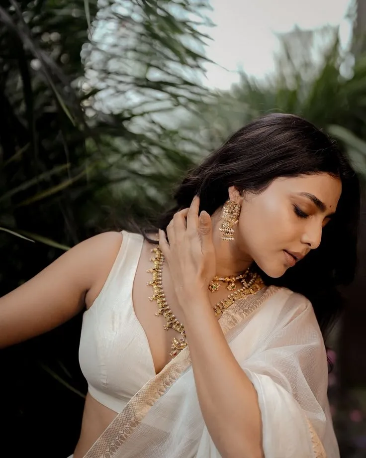 Aishwarya Lekshmi in a white dress with a hot pose wallpaper