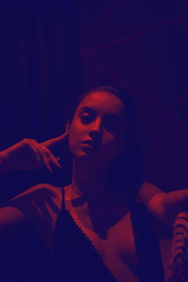 Artistic Moody Silhouette Photo of a Woman in a Dark Setting