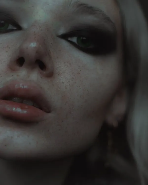 Artistic Portrait of a Woman with Freckles and Smoky Eyes