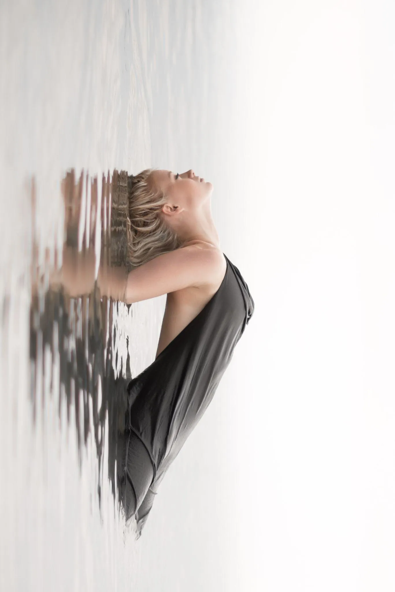 Artistic Reflection Portrait of a Woman in White Background