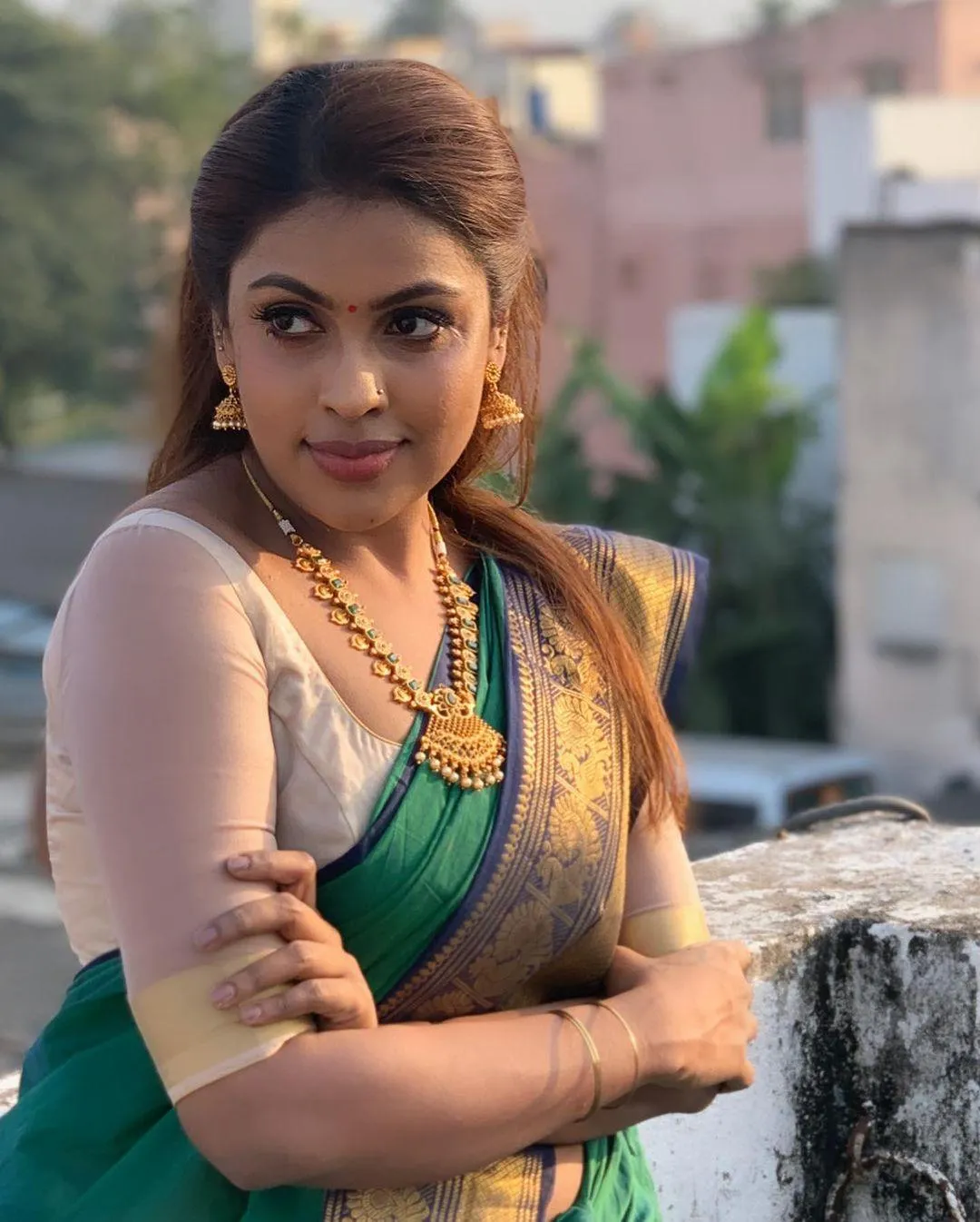 Attractive Srinikha Glowing Elegantly in Classic Green Saree