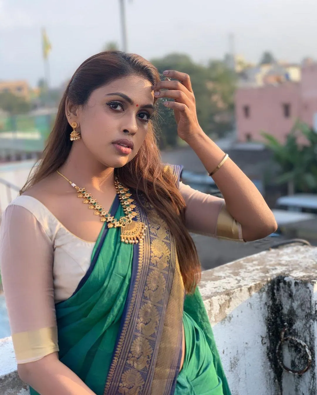 Attractive Srinikha in Green Saree Radiating Timeless Beauty