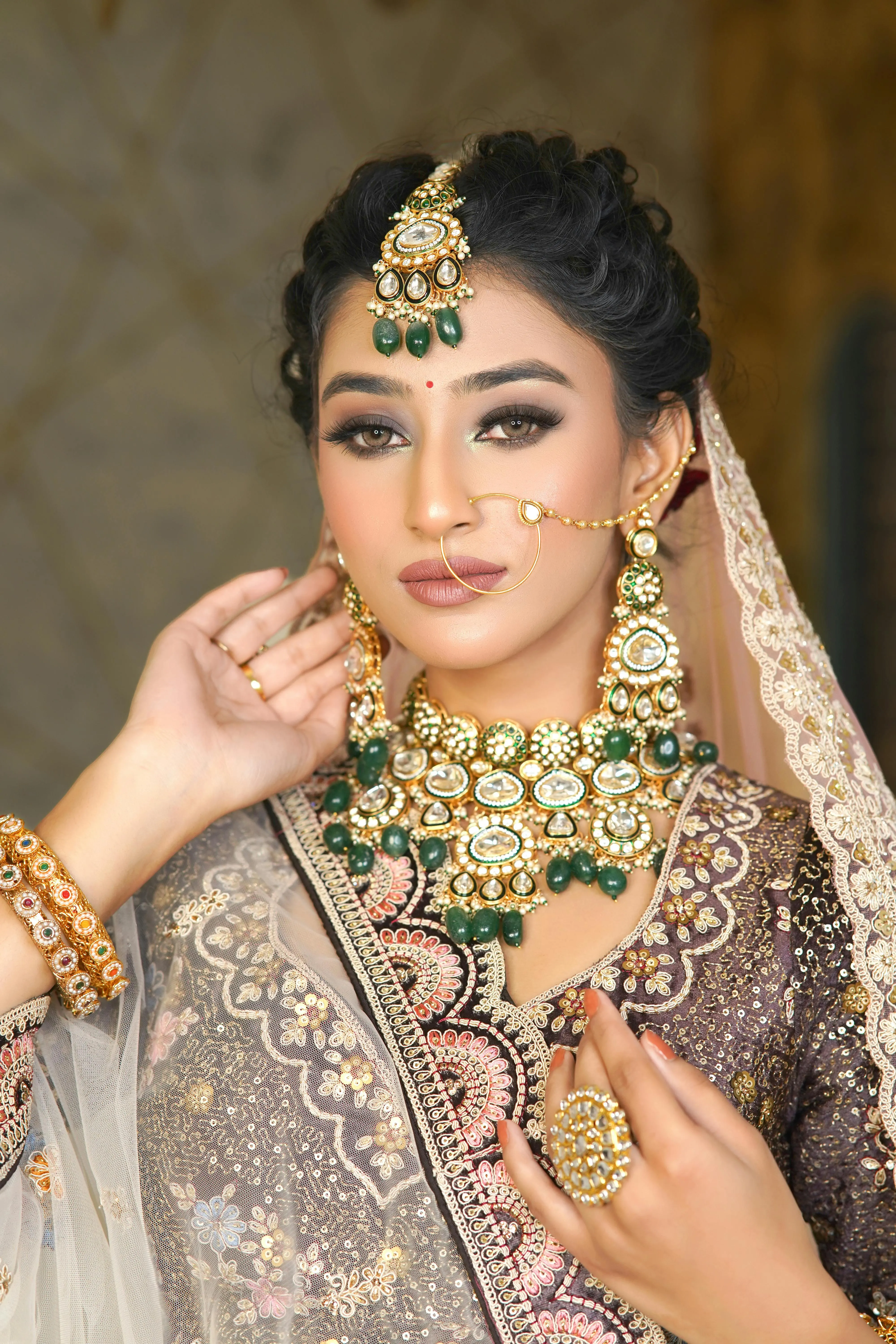 Attractive Young Woman in Beige Saree Wearing Jewelry Image
