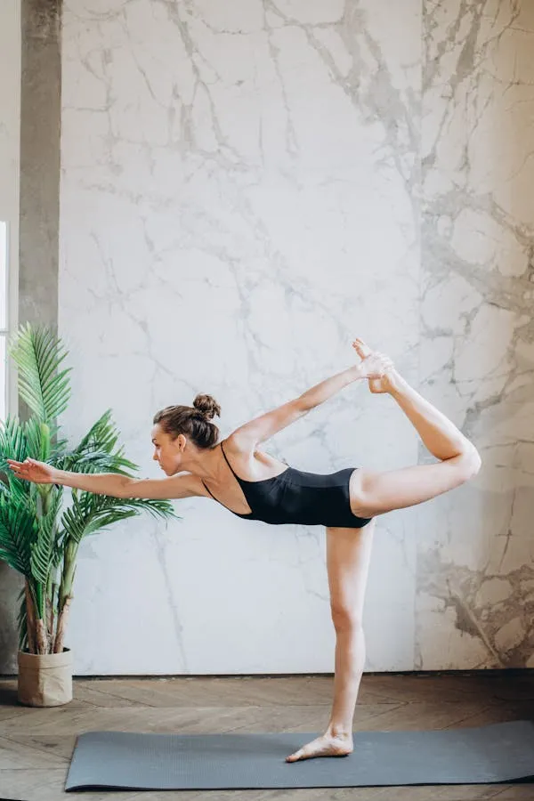 Ballet Dancer Stretches Her Leg Near the Wall Free Wallpaper