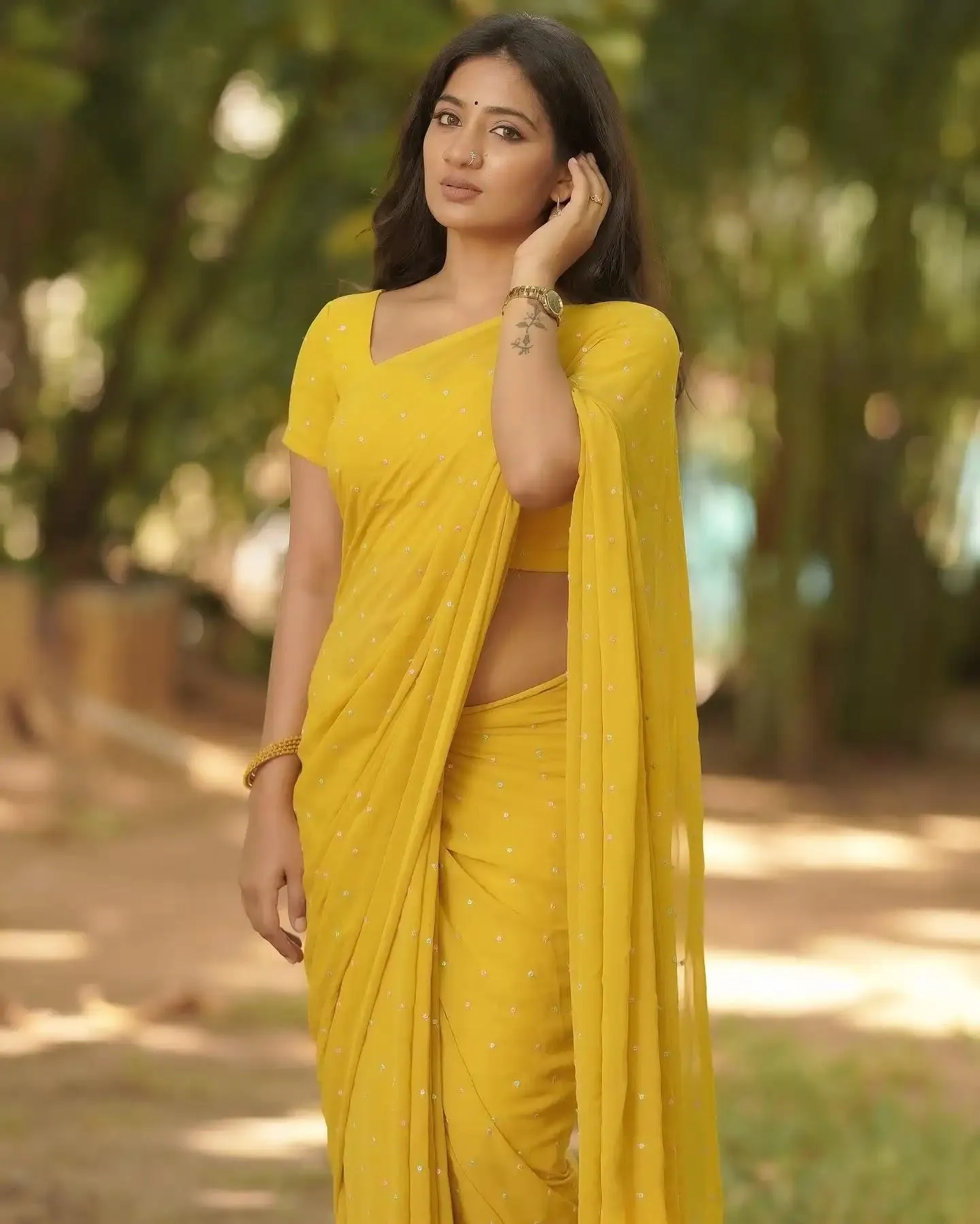 Beautiful Bindu Hima in Yellow Saree Creating Youthful Glow