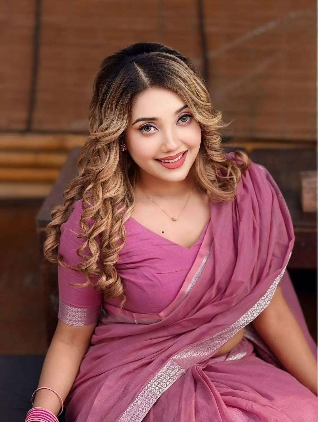 Beautiful Taj Mira Islam in Lovely Purple Saree Pose Picture
