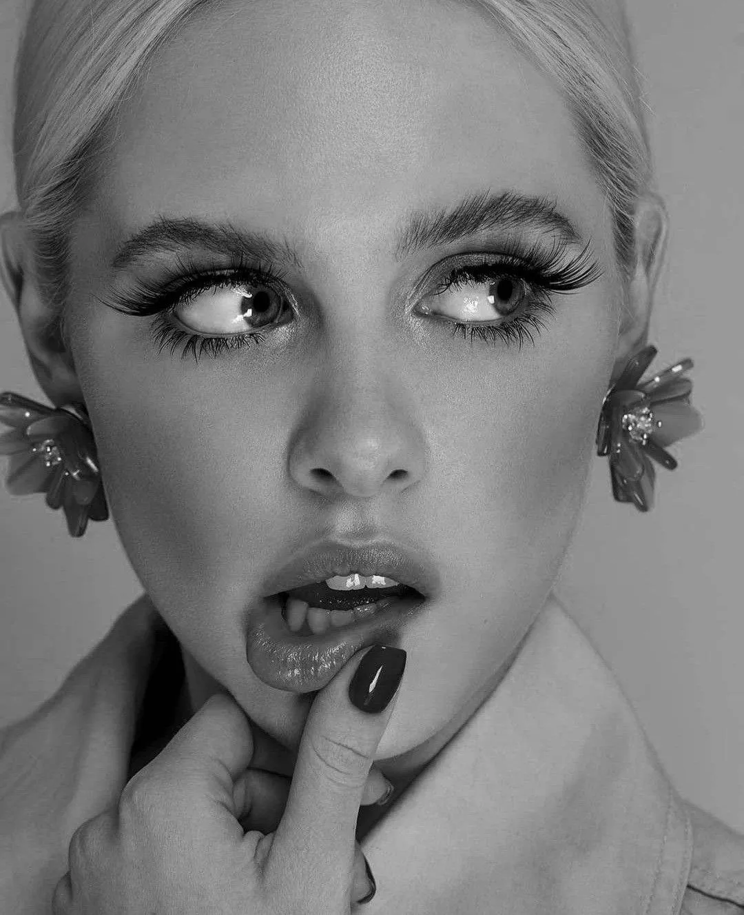 Black and White Close Up of a Woman with Floral Earrings