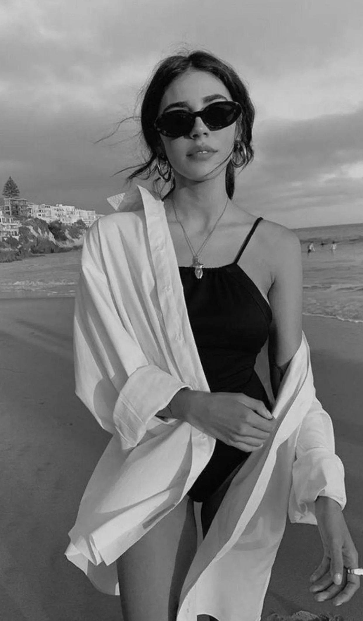 Black and White Image of a Woman Wearing Sunglasses Outside