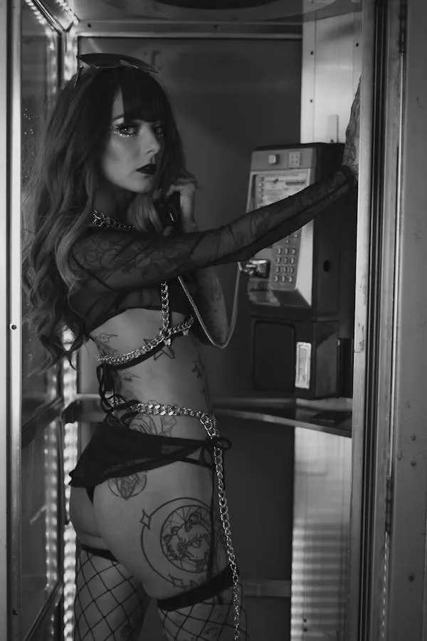 Black and White Photo of a Model in an Edgy Tattooed Outfit
