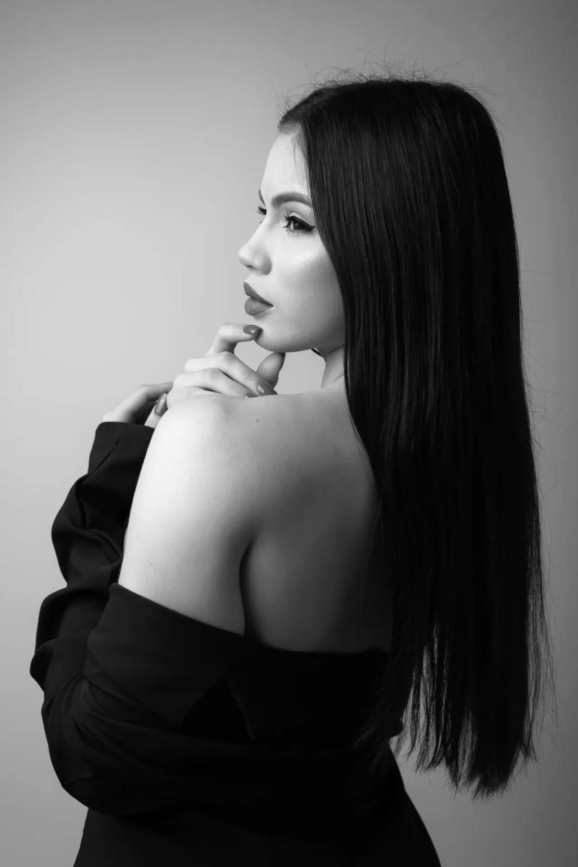 Black and White Photo of a Woman Looking Sideways with Grace