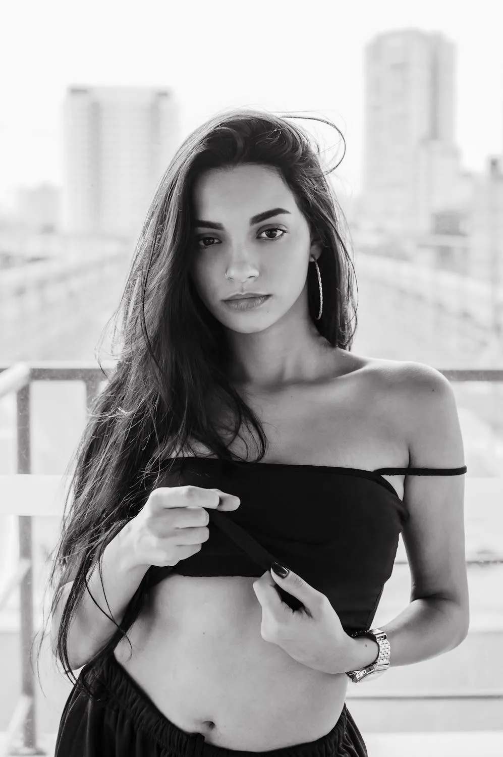 Black and White Portrait of a Woman in Urban Rooftop Setting