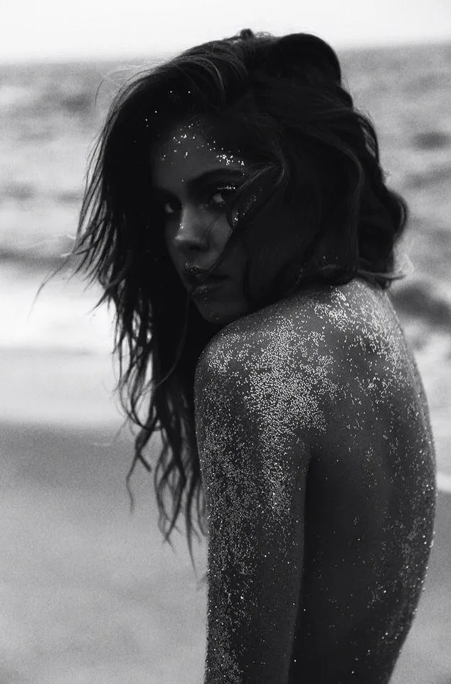 Black and White Portrait of a Woman with Wet Hair and Sand