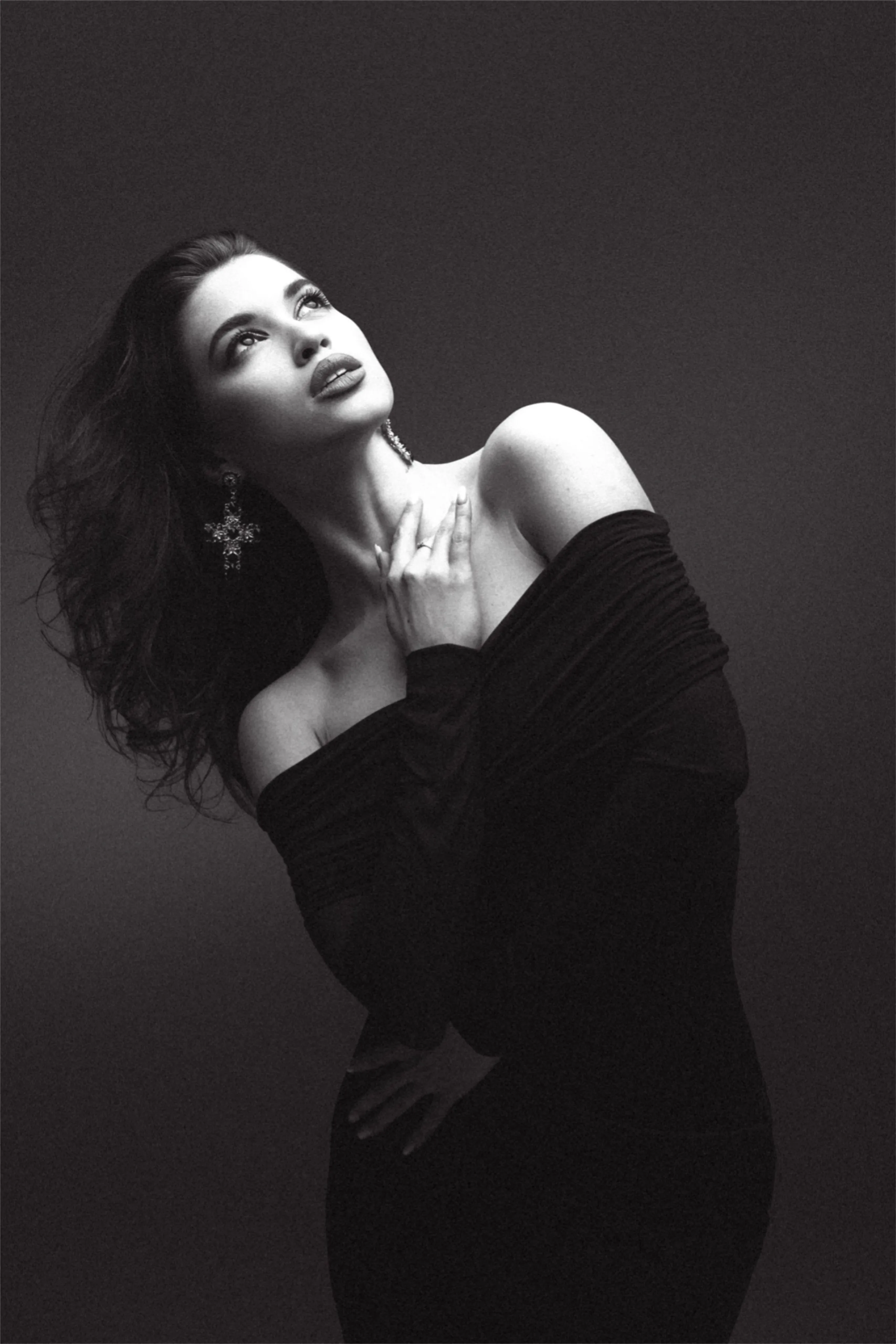 Black and White Studio Portrait of a Woman in a Dark Dress