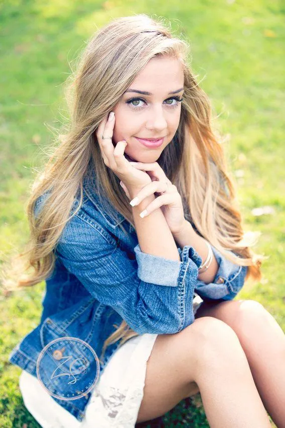 Blonde Woman in a White Top Posing with Soft Expression