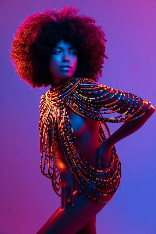 Bold Afro Woman Wearing a Colorful Beads in Studio Light