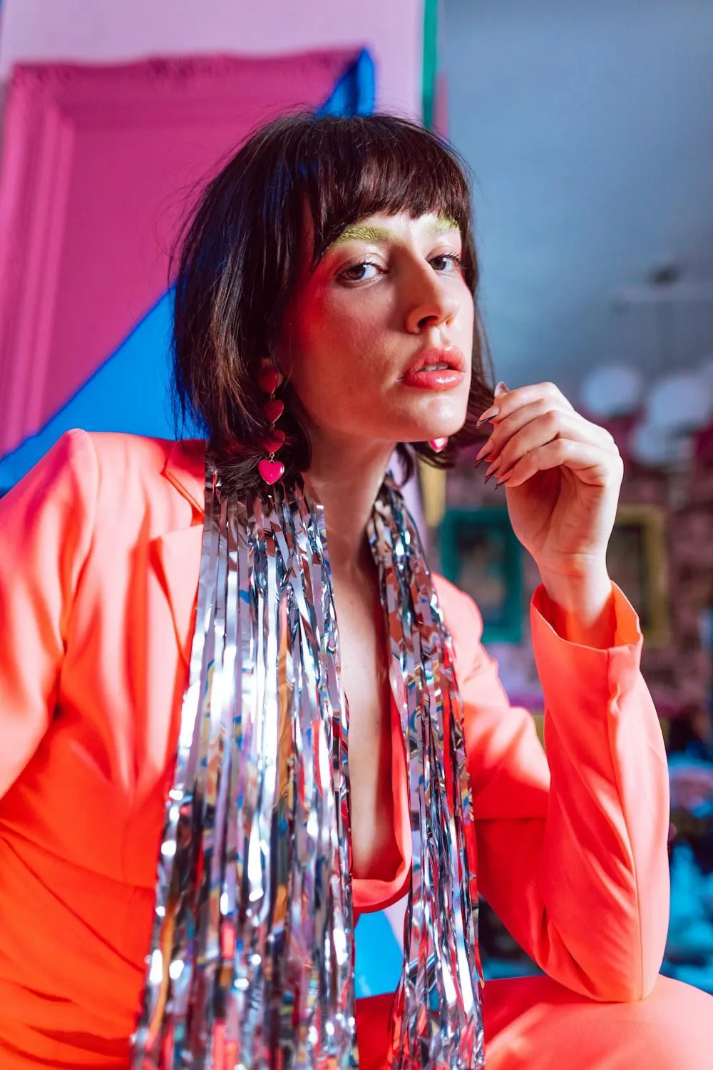 Boldly Dressed Woman Striking a Pose in a Vibrant Setting