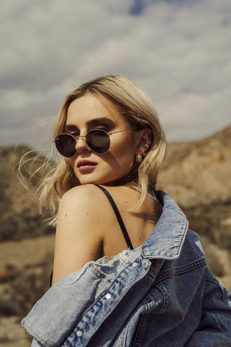 Casual Woman Sits on Ledge Outdoors During Warm Fall Evening
