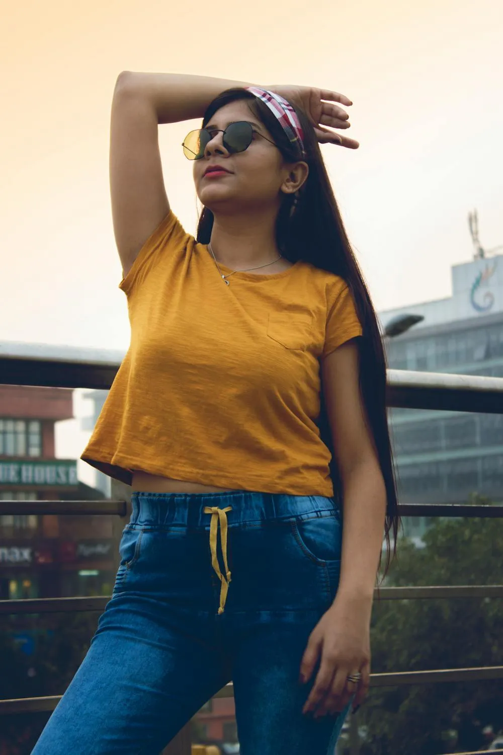 Casual Woman in a Yellow Top Enjoying Sunshine on Rooftop