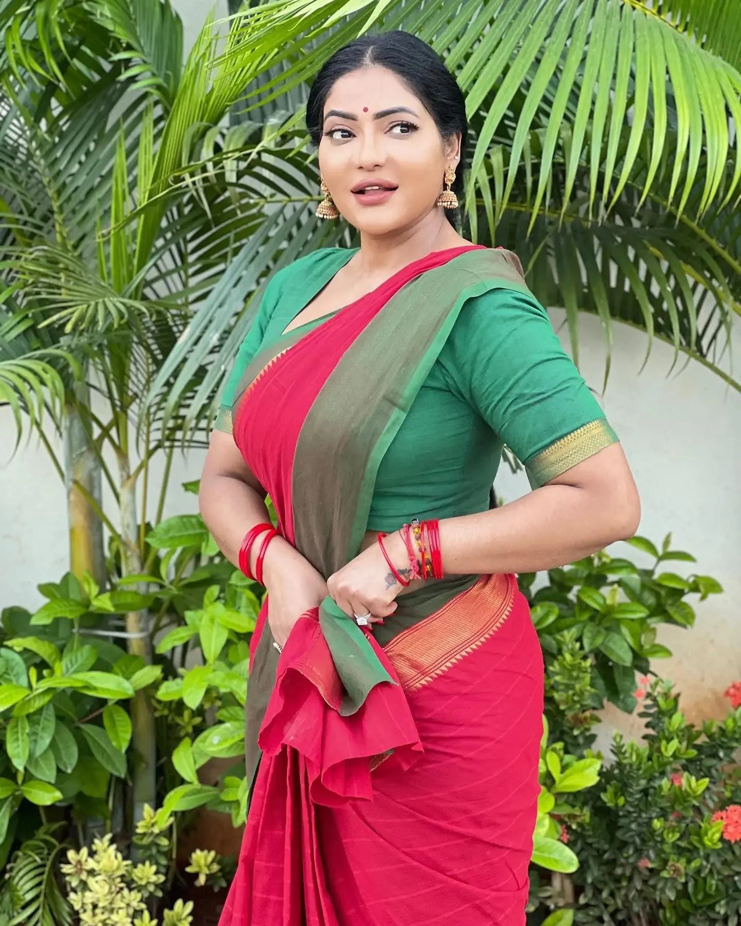 Charming Reshma Pasupuleti in Pink Saree Garden Pose Picture