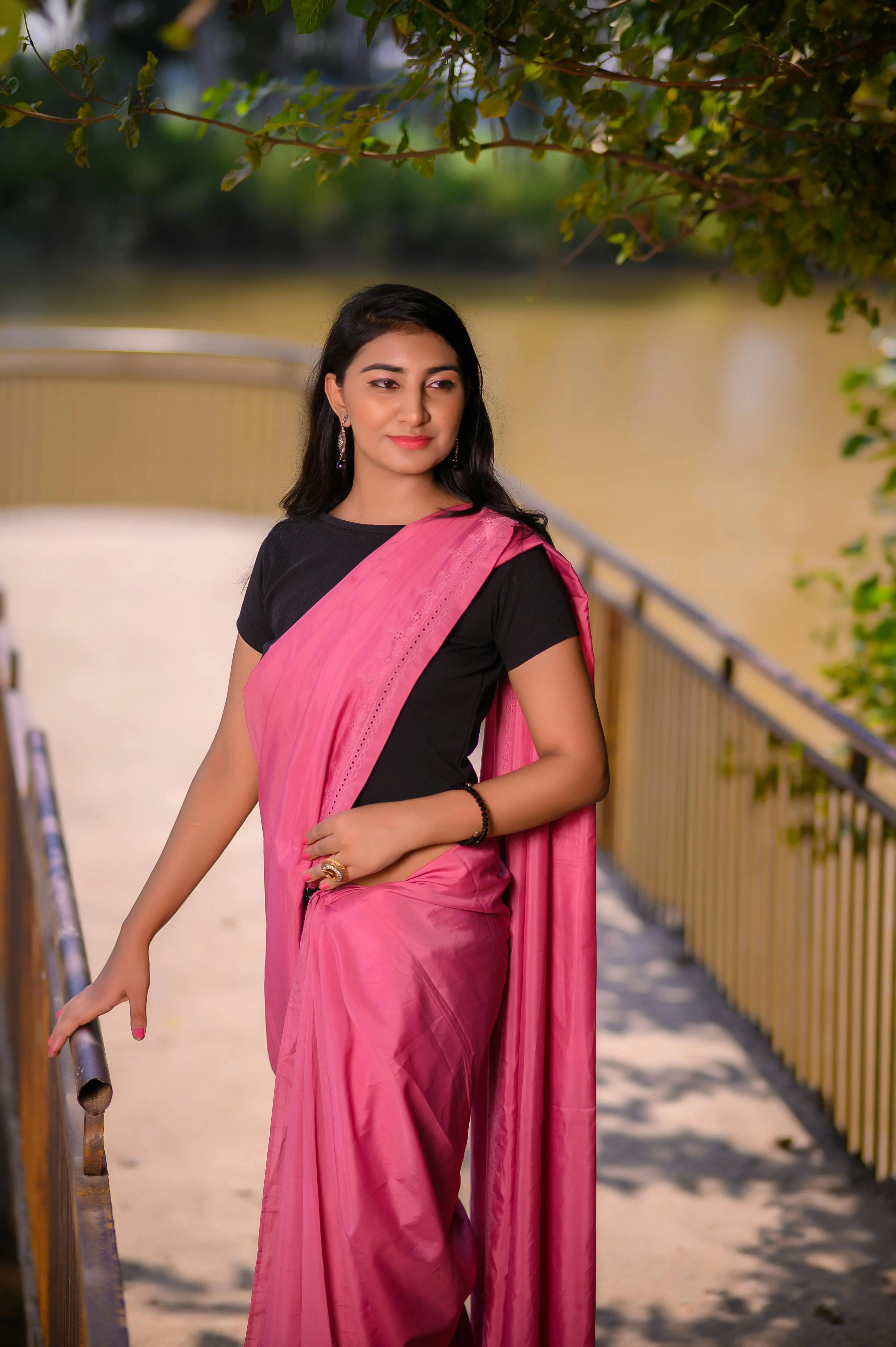 Charming Young Woman in Pink Saree Outdoor Portrait Image