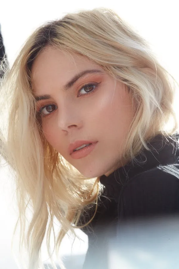 Close Up of a Blonde Woman with Bold Makeup Free Wallpaper