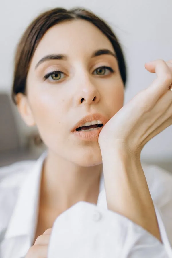 Close Up of a Model with a Natural Look and Soft Hand Gesture