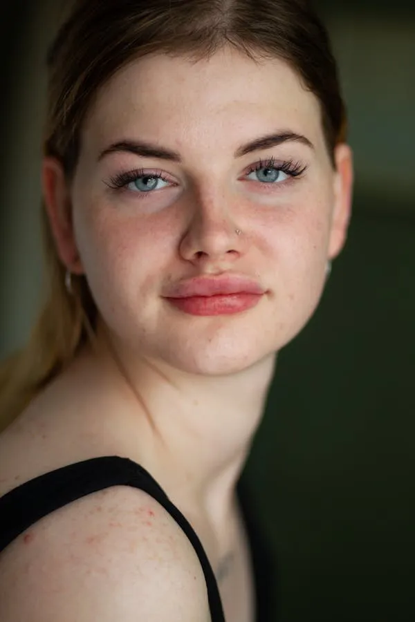 Close Up Portrait of a Woman with Light Makeup and Blue Eyes