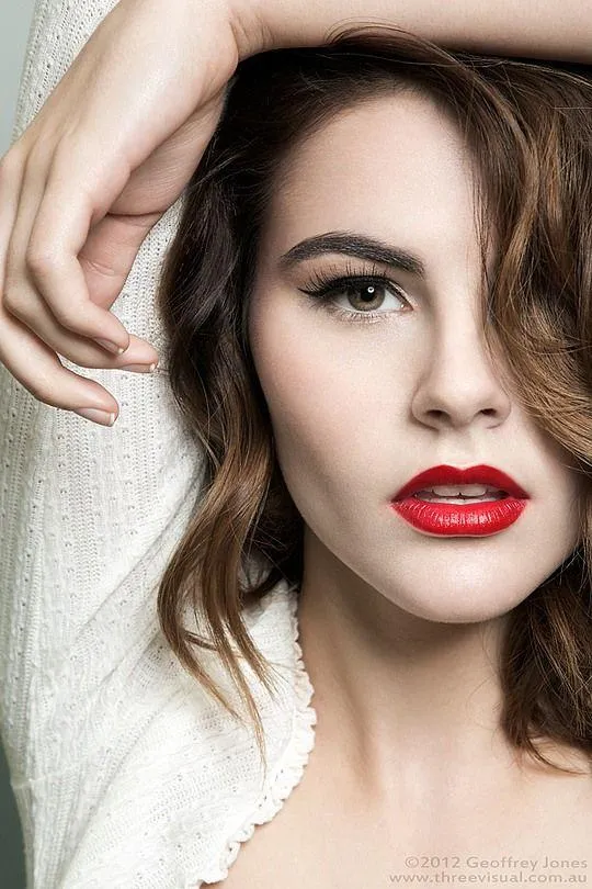 Close Up Portrait of a Woman with Red Lipstick and Curls