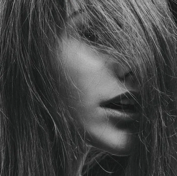 Close Up of Woman with Flowing Hair in Black and White Shot