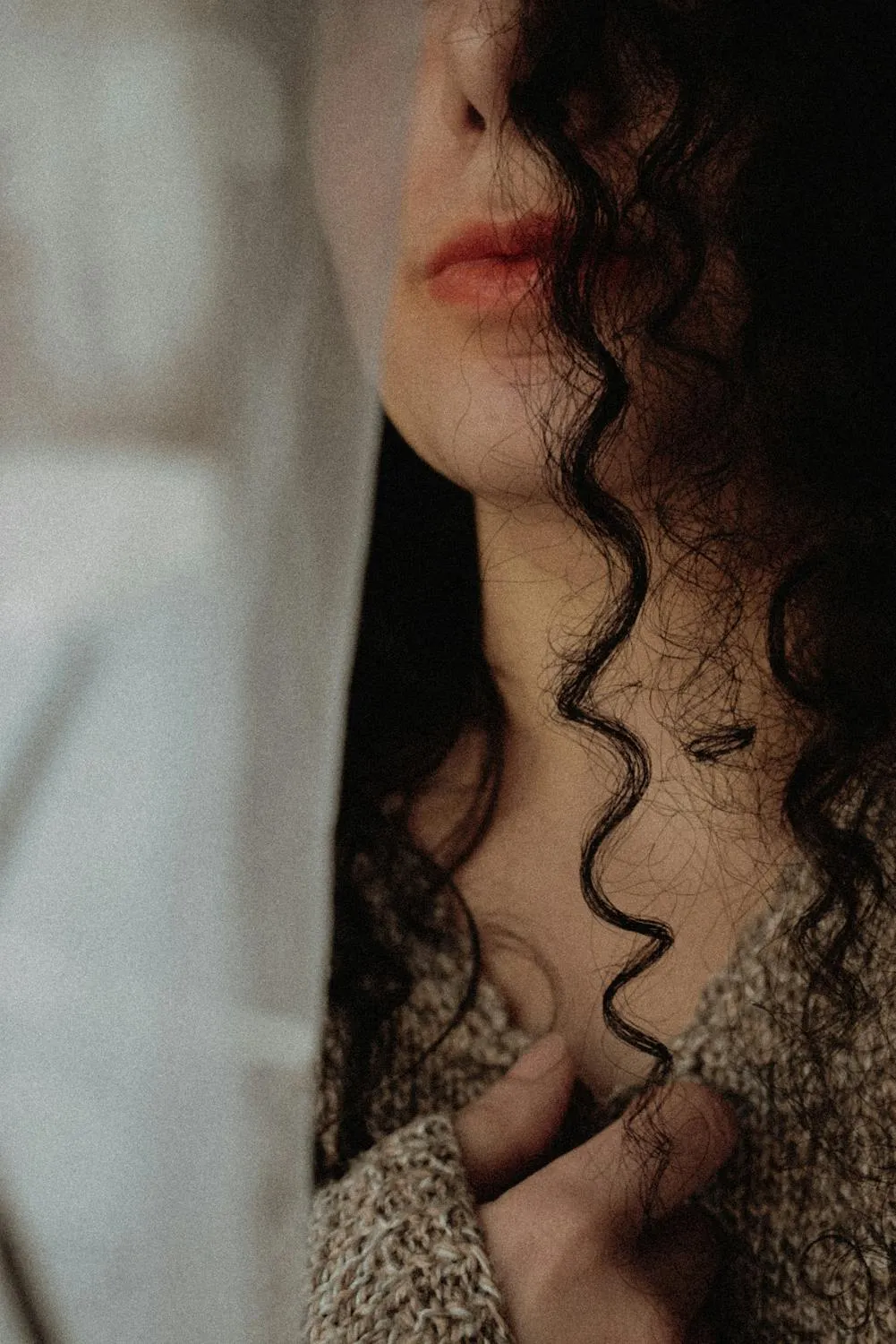 Close Up of Woman Lips and Curly Hair with a Cozy Sweater