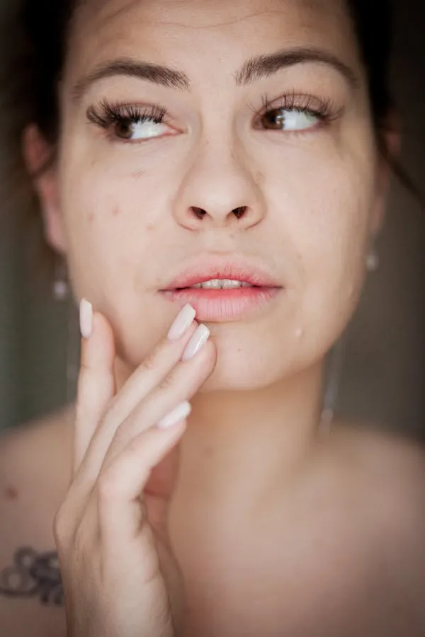 Close Up of a Woman with Minimal Makeup Looking Thoughtfully