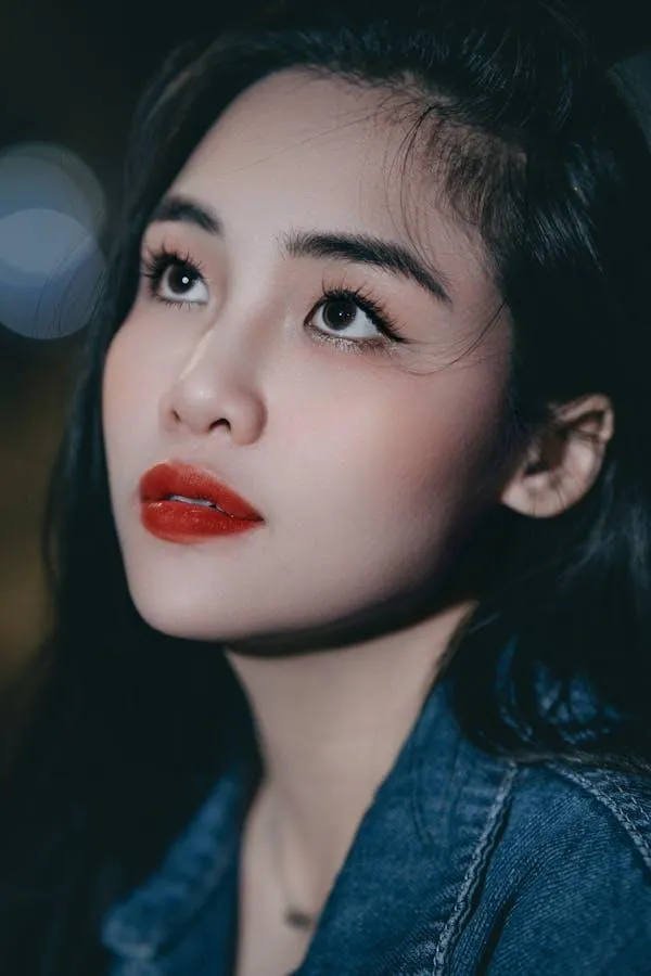 Close Up of a Woman with Red Lips and a Blue Denim Jacket